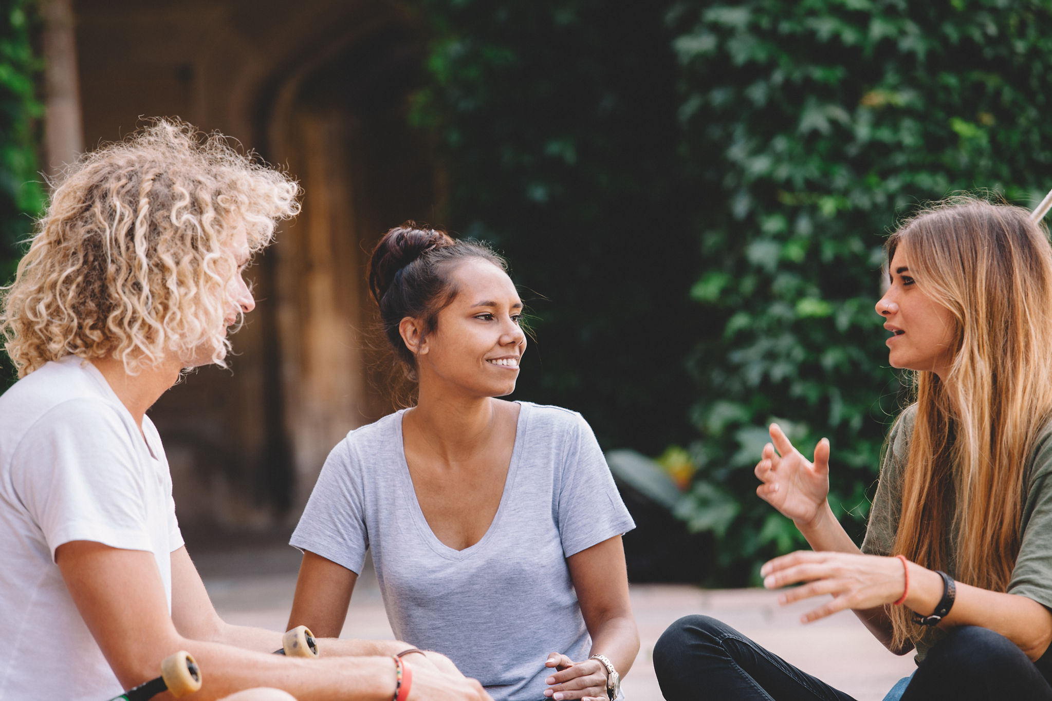 Three friends having a conversation