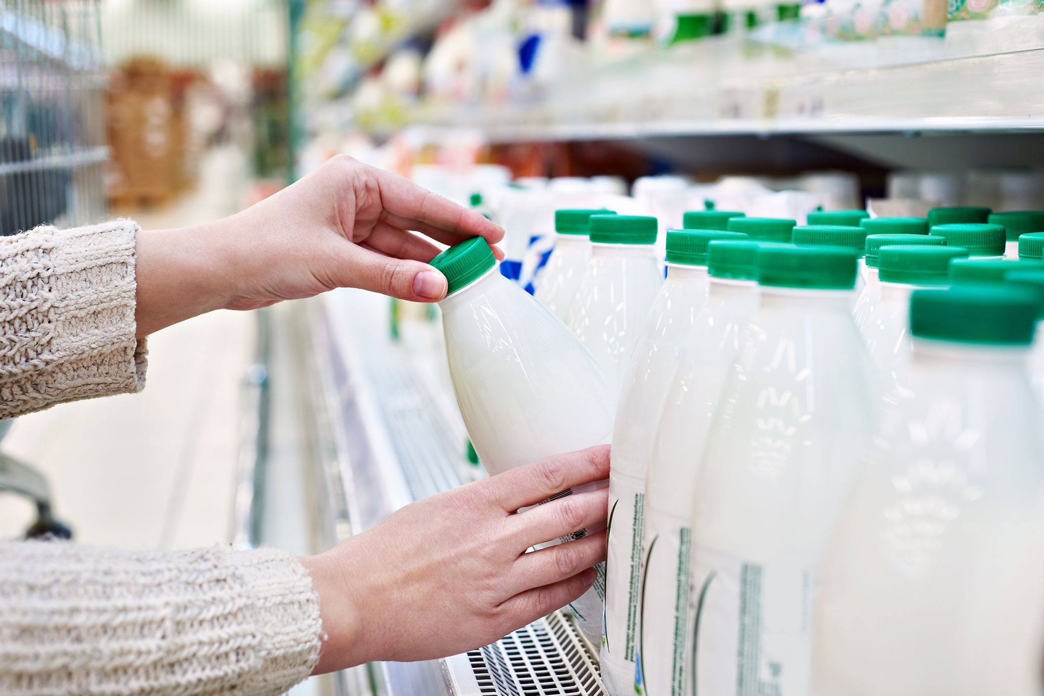 Buying milk at a grocery store.