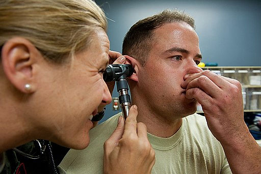 Capt. Sarah Freidel, 34th Bomb Squadron flight surgeon, performs a valsalva maneuver on Staff Sgt. Jacob Appleby, 28th Medical Operations Squadron ambulance services technician, during a physical exam in the flight medicine clinic on Ellsworth Air Force Base, S.D.