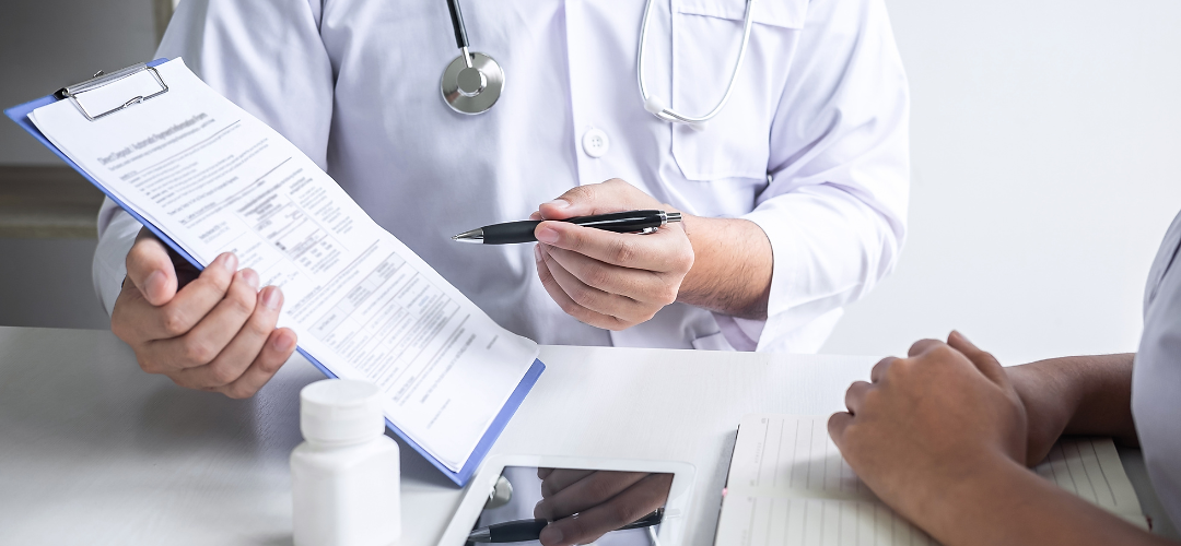 Doctor showing patient a chart. 