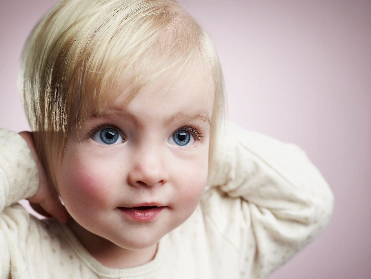 Baby covering ears after ear tubes/tympanostomy/myringotomy.