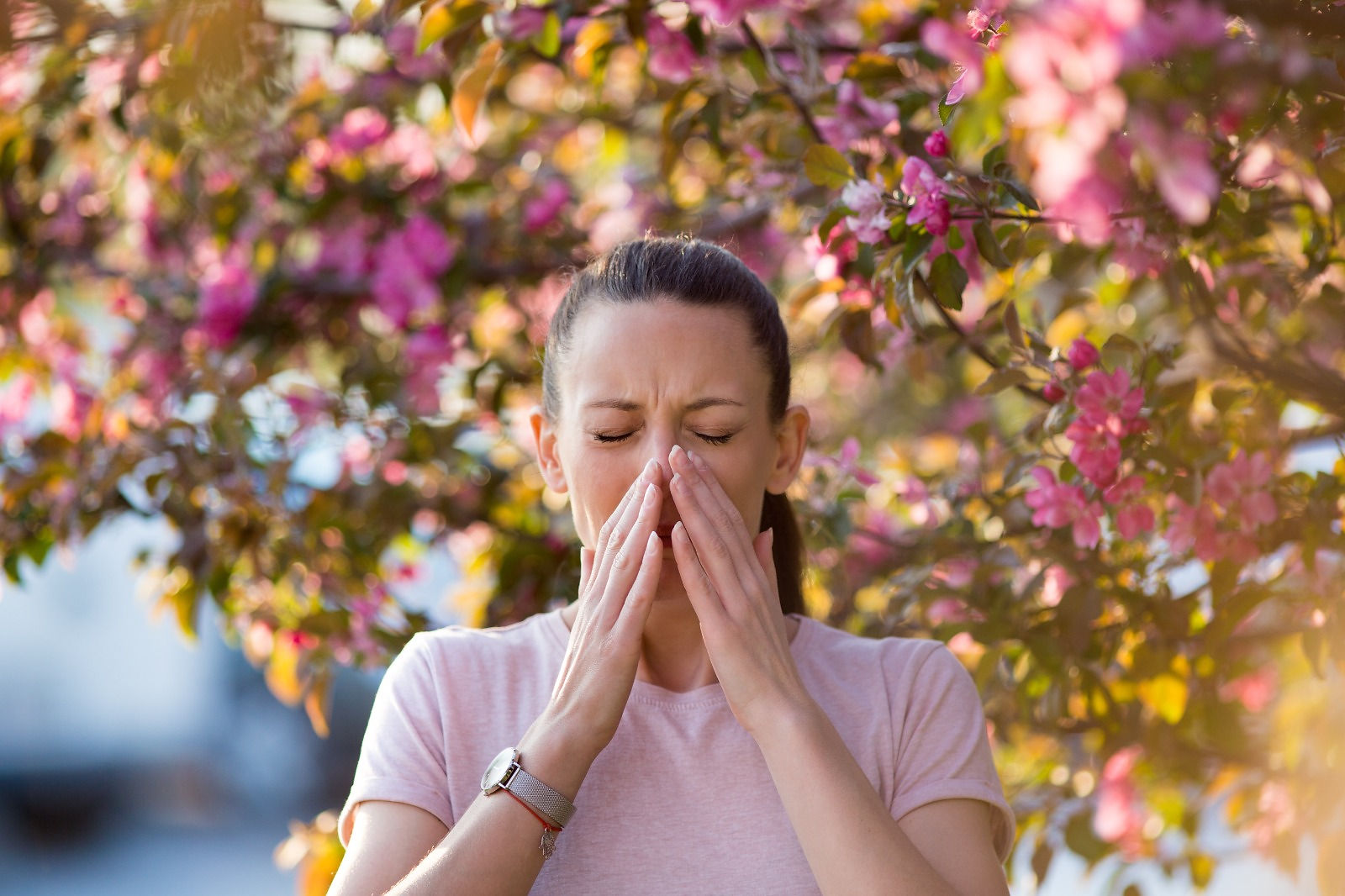 Woman with hay fever outdoors.